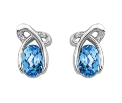 BOUCLES EN OR BLANC SERTIES DE TOPAZES BLEUS ET DE DIAMANTS