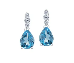 BOUCLES EN OR BLANC SERTIES DE TOPAZES BLEUS OU DpiAIGUEMARINES ET DE DIAMANTS CANADIENS