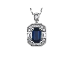 PENDENTIF EN OR BLANC SERTI DpiUN SAPHIR BLEU DE SAPHIRS BLANCS ET DE DIAMANTS